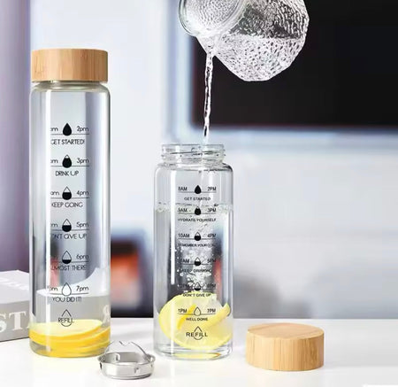transparent glass water bottle with wooden lid main image