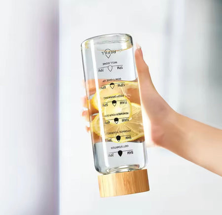transparent glass water bottle with wooden lid image 3