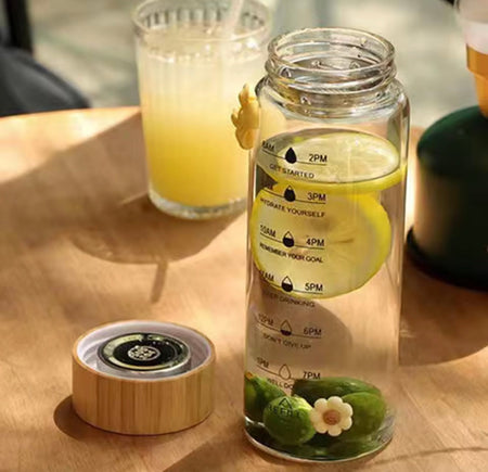transparent glass water bottle with wooden lid image 6