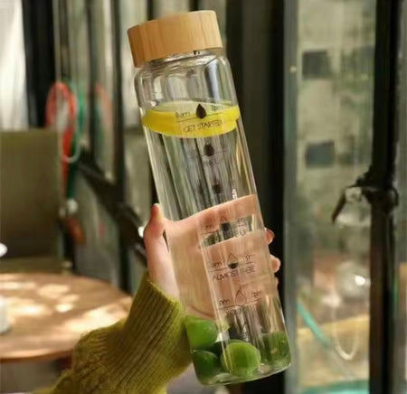 transparent glass water bottle with wooden lid image 2