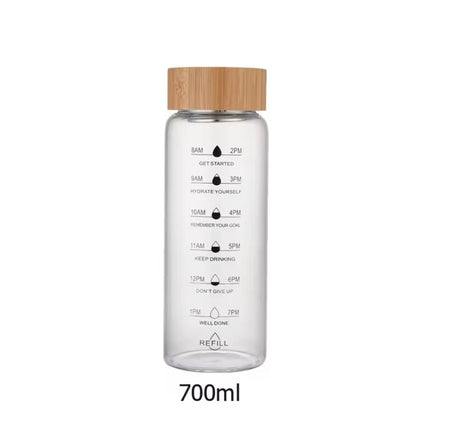 transparent glass water bottle with wooden lid image 8