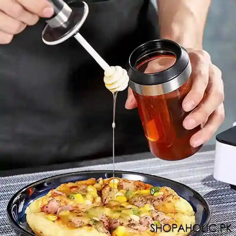 glass storage jar with honey stick image2